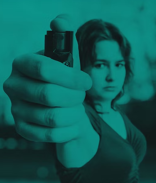 Image of woman holding pepper spray canister